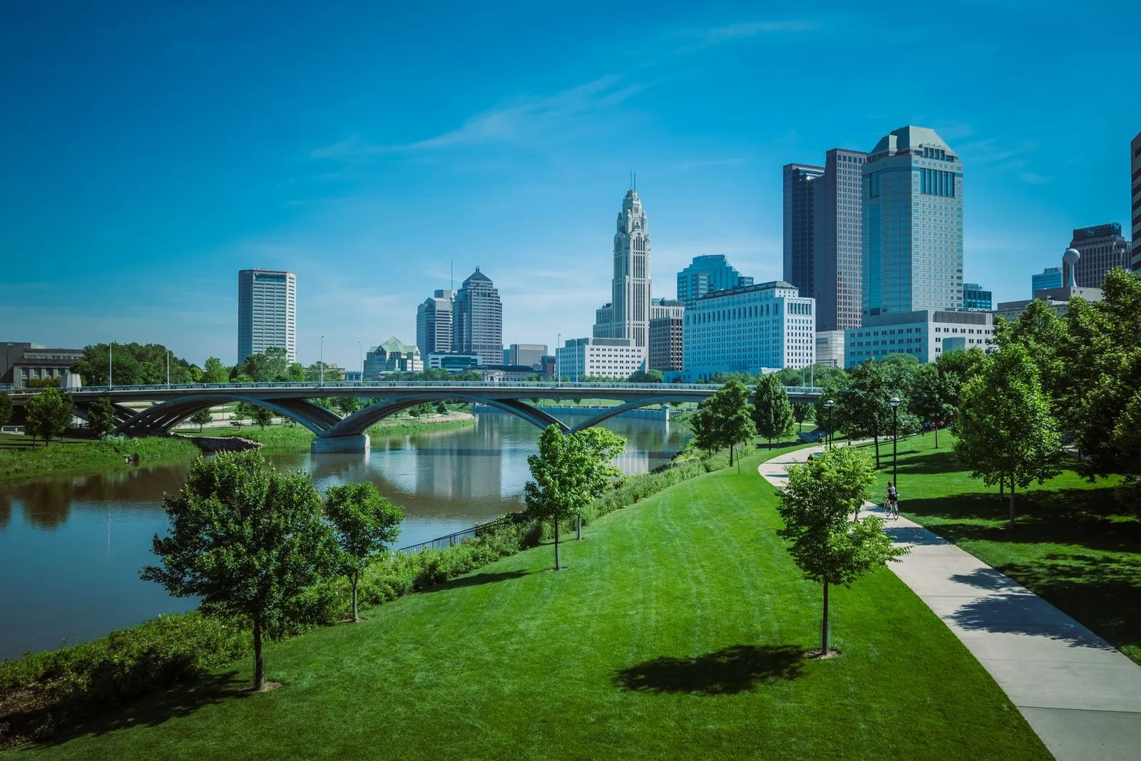 Downtown Columbus towers reflected in the river below them