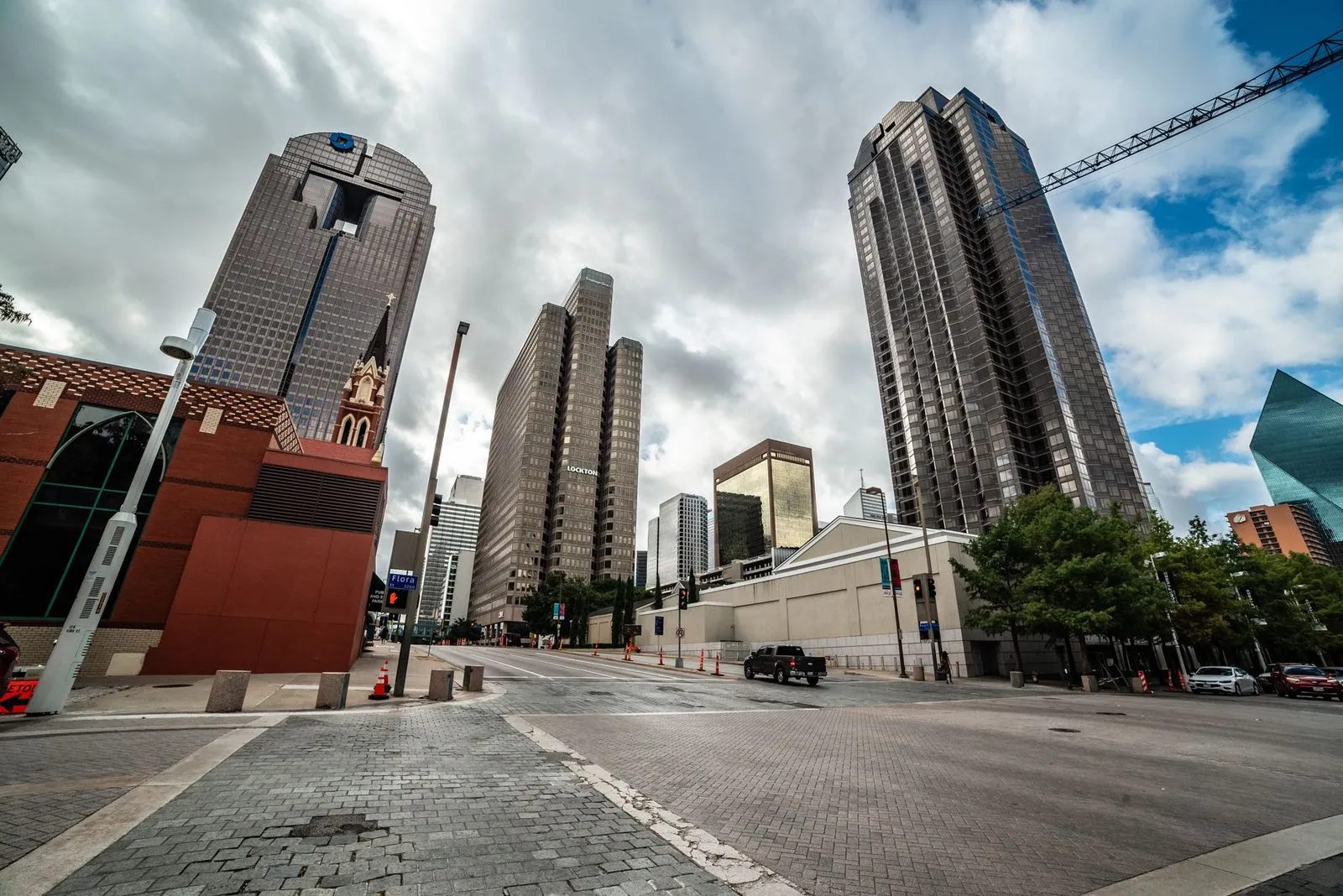 Downtown Dallas towers rising behind lower blocks on a clear day
