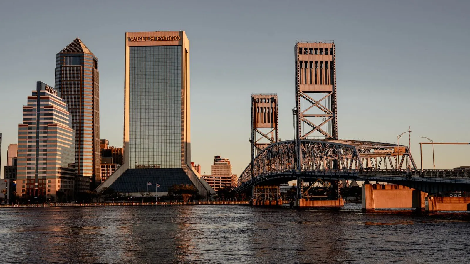 The Jacksonville skyline beside a bridge over the St. Johns River