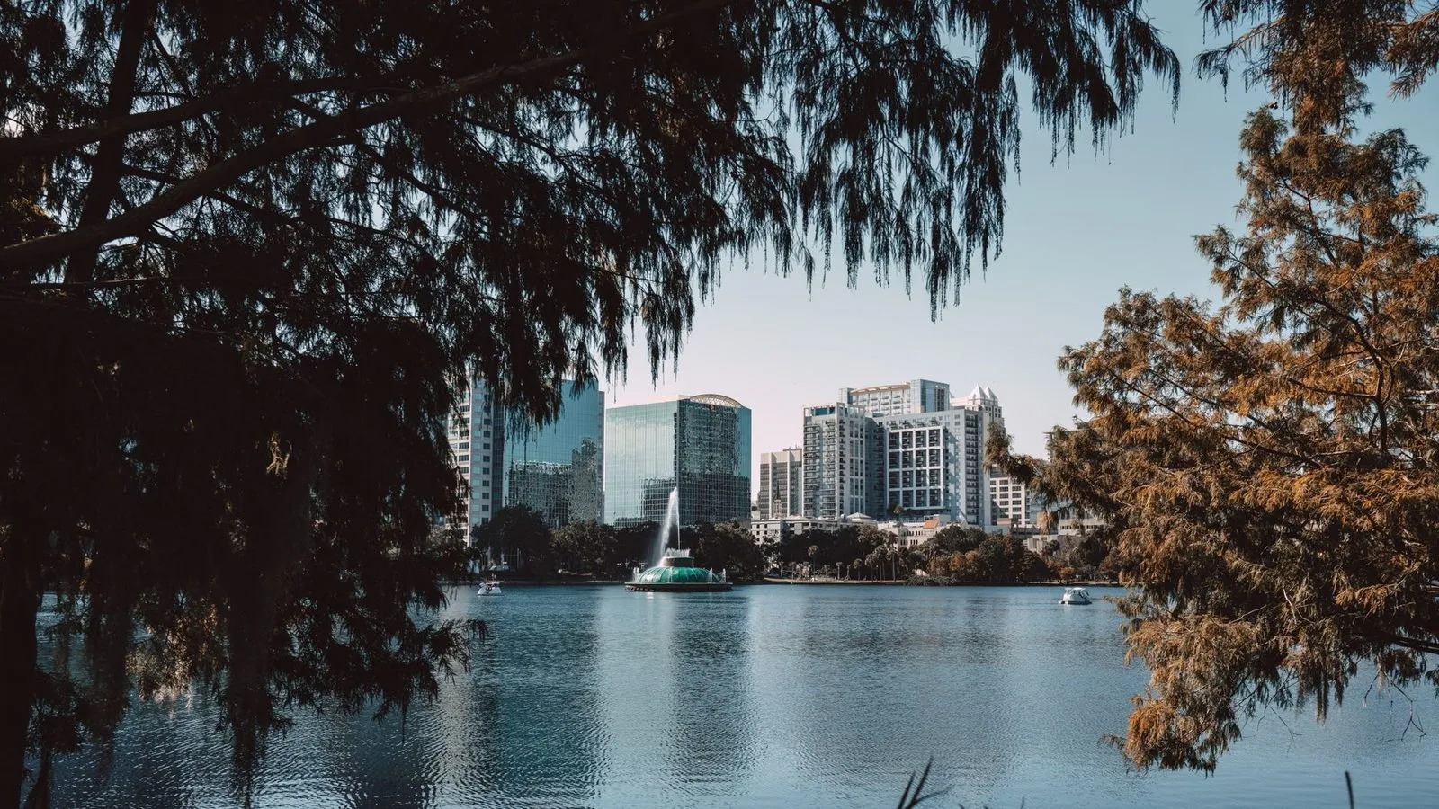 Downtown Orlando reflected in the lake in front of it