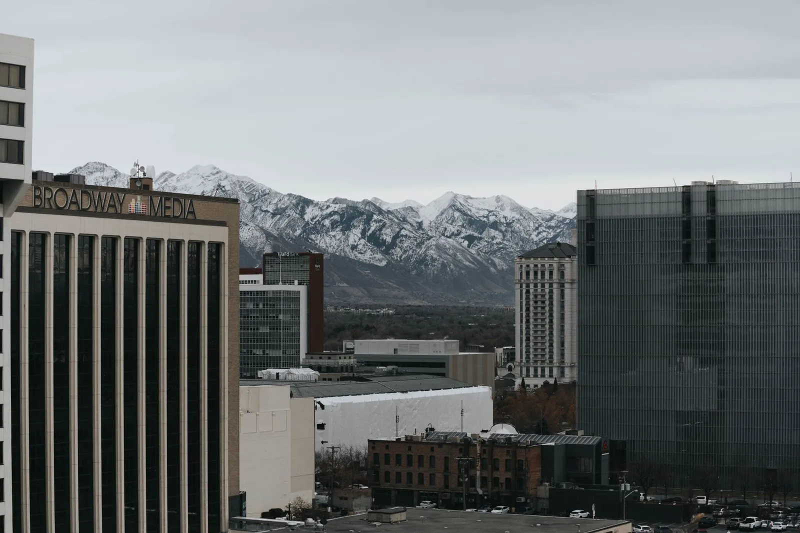Salt Lake City rooftops under the snow-capped Wasatch range