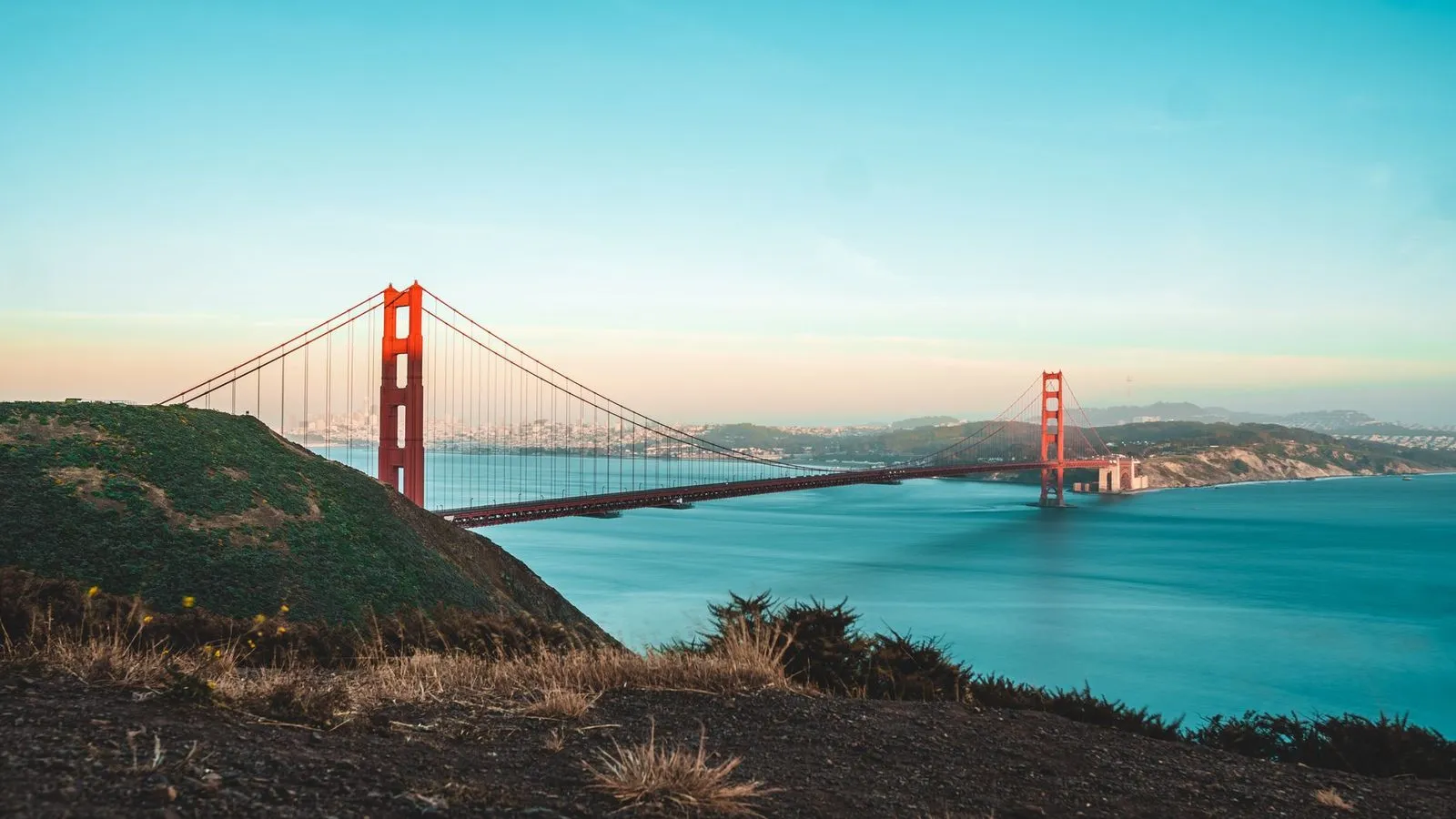 The Golden Gate Bridge with the San Francisco skyline behind it